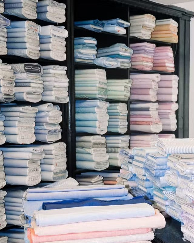 Shelves of shirt fabric at Charvet
