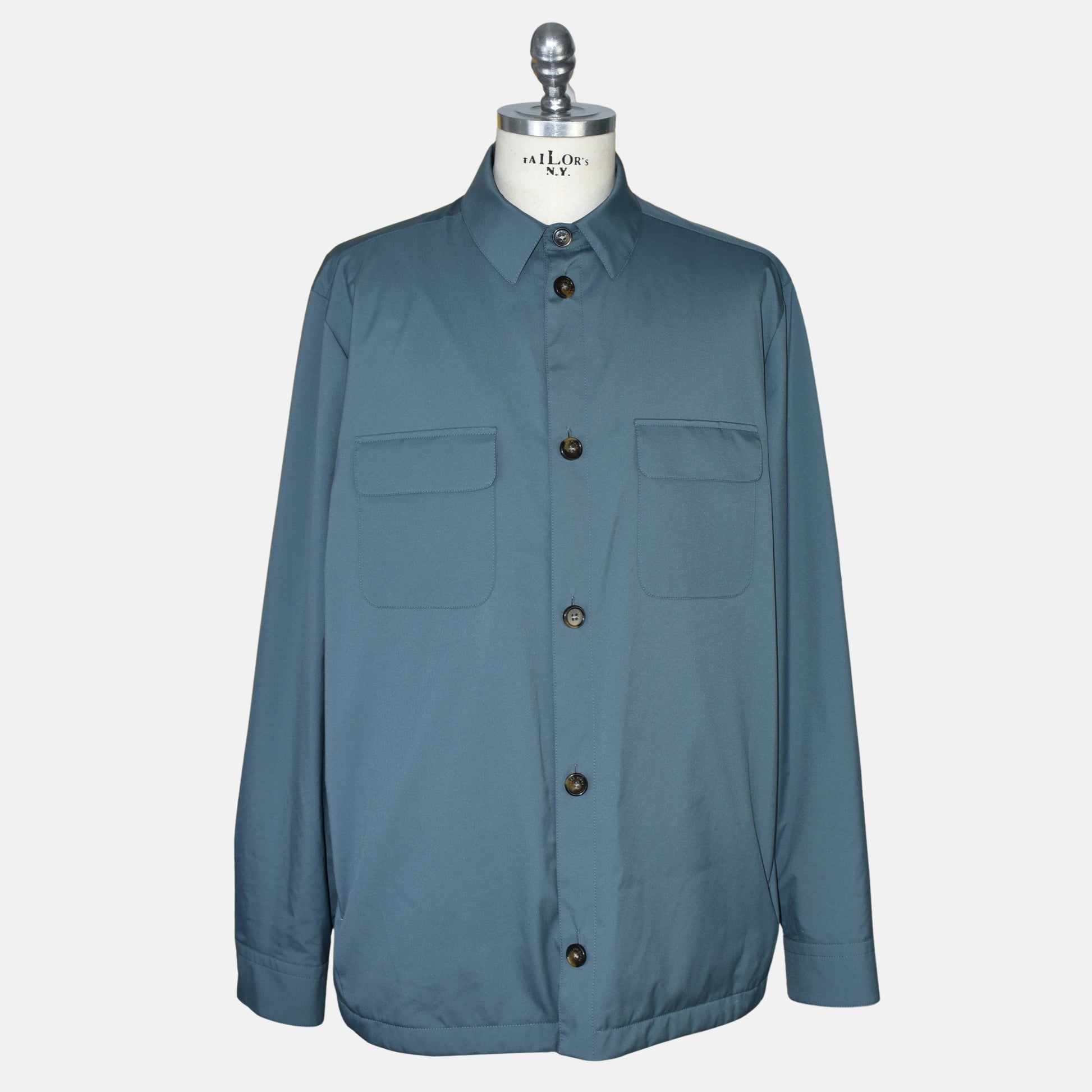 Loro Piana petrol Storm System jacket on a tailor's dummy, buttoned front