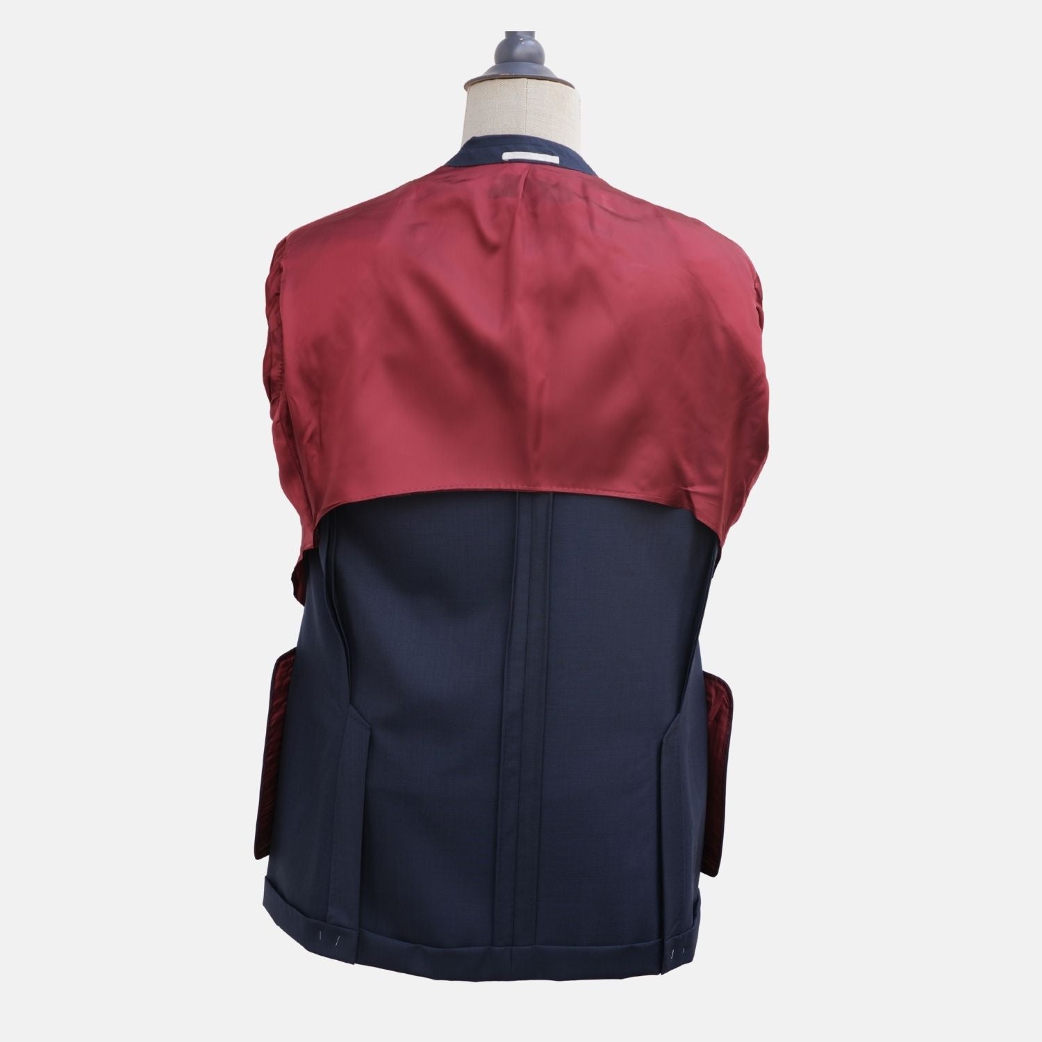 Interior back view of the suit jacket showing its burgundy lining