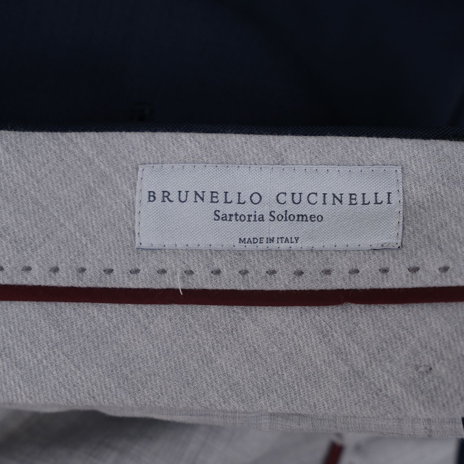 Close-up of the trousers' interior waistband with the Brunello Cucinelli Sartoria Solomeo label