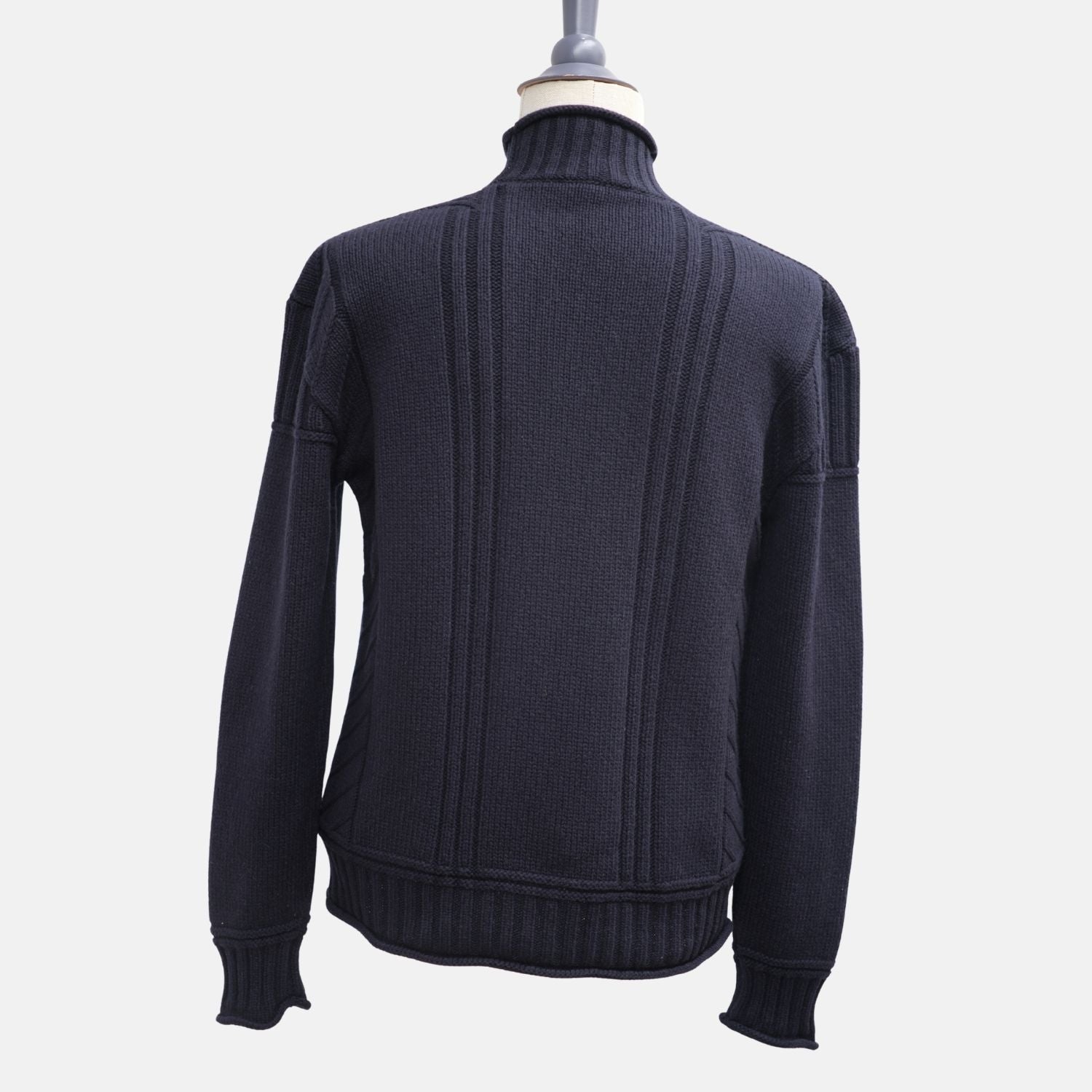 Back view of the Loro Piana navy cashmere turtleneck on a mannequin