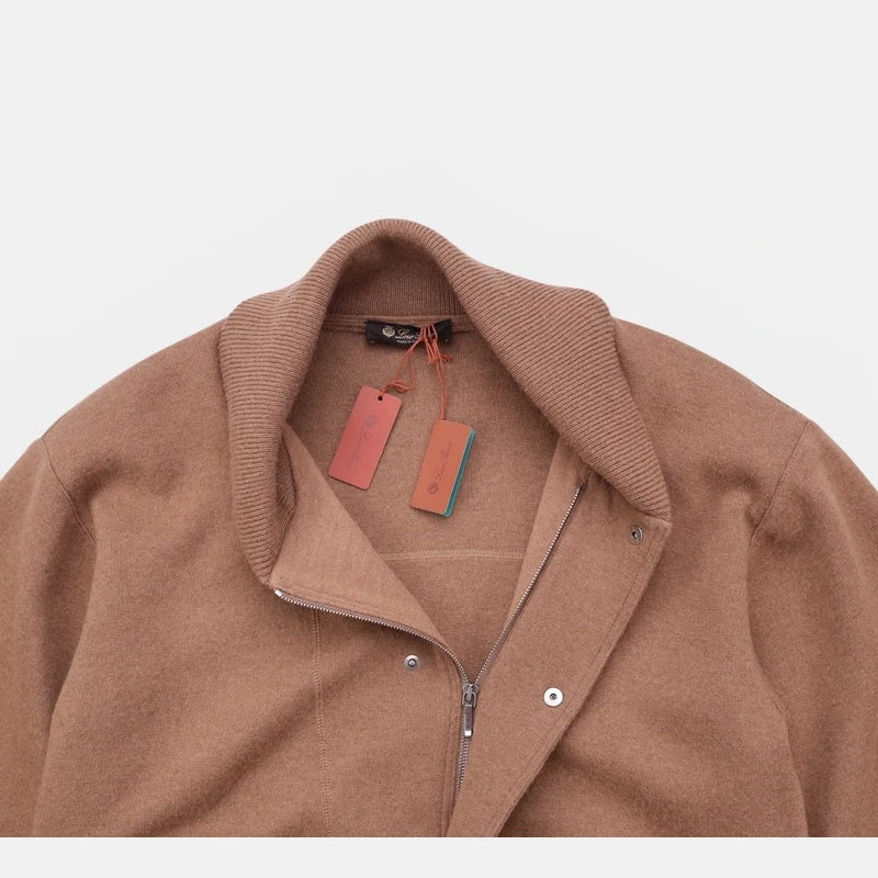 Close-up of the shawl collar on the Loro Piana camel jersey bomber jacket with brand hang tags