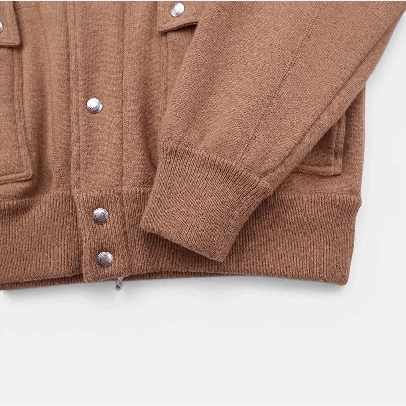 Detail of the ribbed cuff and snap button on the Loro Piana camel jersey bomber jacket