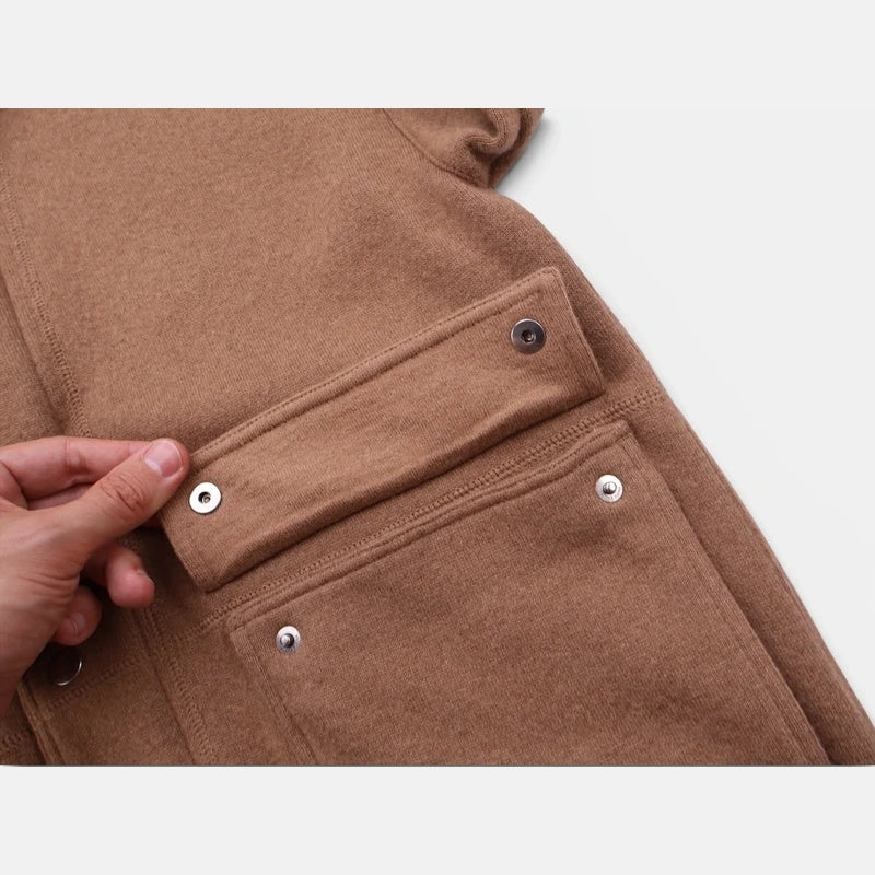 Detail of the snap-button flap pocket on the Loro Piana camel jersey bomber jacket
