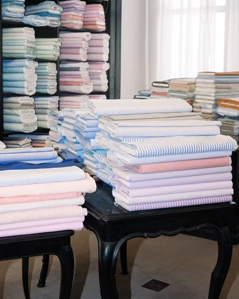 Stacks of shirt fabric at Charvet