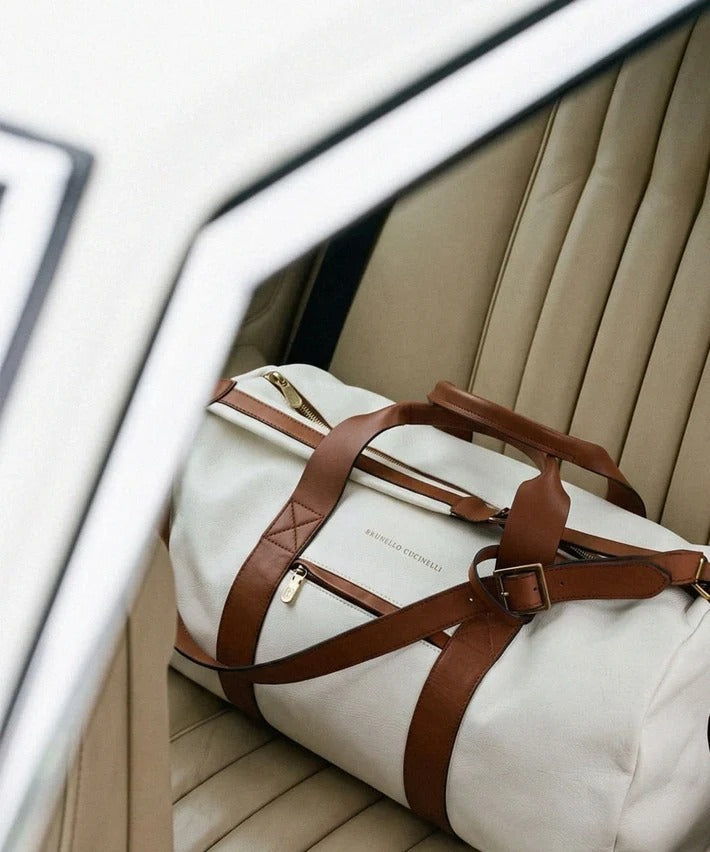 Brunello Cucinelli weekender on a car seat